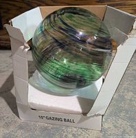 Gazing ball in box showing size label