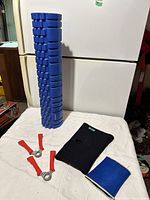 Group shot showing foam roller, hand grips, knee brace, knee support