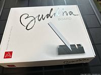 Front of sealed Buddha Board retail box