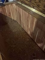 lid open showing cedar-lined interior and brass-tone chain stay