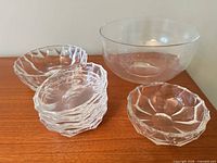 Group showing all bowls: large smooth bowl, faceted serving bowls, stack of individual bowls