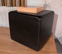 Cube ottoman with wood box on top, side view of ottoman