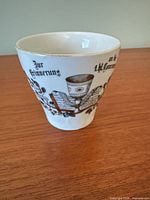 Flared porcelain mug with German inscription and religious imagery