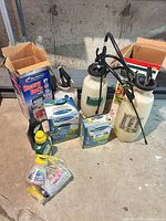 Group shot of all lawn care items on floor