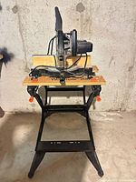 Front view of Craftsman mitre saw mounted on Workmate stand