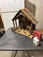 Full nativity set with stable and decor blocks on table