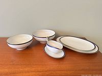 Group shot showing all five porcelain serving pieces
