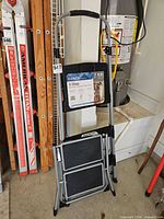 Stool folded with Cosco label visible