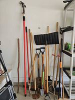 All tools grouped against wall showing variety and condition