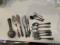 Full layout of all flatware pieces on countertop