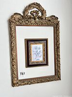 Front view showing full ornate gilded frame, inner frame, mat, and print