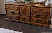 Front view showing entire dresser, drawer layout, center cabinet