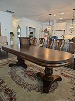 Full view of oval dining table in room