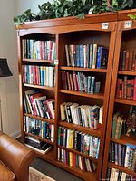 Front view of oak bookcase showing shelves and mission styling