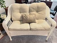 front view of loveseat with cushions and lumbar pillow