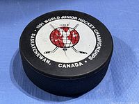 Top face of puck with championship logo