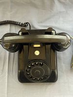 Top view showing full telephone body, dial, handset rest, PTT badge