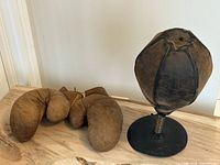 Overview of gloves and speed bag on wood surface