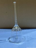 full view of crystal dinner bell standing upright