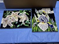 Both ceramic tile plaques side by side