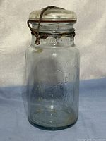 Front view of jar showing embossing and wire bail