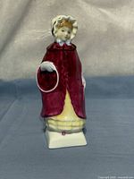 Front view of Georgina figurine showcasing colors, pose and hoop