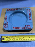 Top view showing full ashtray and ruler for size