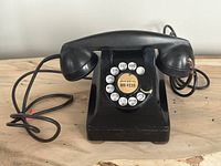 Front view of Northern Electric rotary telephone with handset and dial visible