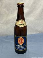 Front view showing full Whitbread Pale Ale label, neck label, and crown cap