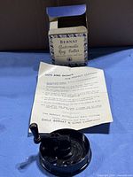 Rug cutter, box and instruction sheet displayed