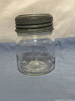 Full view of jar with metal lid attached