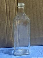 Full view of clear rectangular measuring bottle