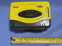 Top view showing RCA branding, All Weather Sports Stereo label, auto reverse and bass boost markings