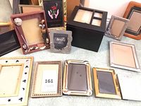 Group view of assorted frames spread on floor