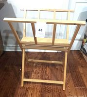 Front view of beech folding print rack with lot tag attached