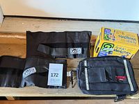 Boxed pair of GoFit adjustable ankle weights alongside loose weights and pouch