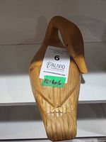 Top view of carved wooden duck showing overall shape and grain