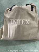 Fabric carry bag with IN TEX logo