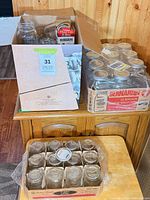 Open box with assorted Bernardin jars, unopened Bernardin case, unopened Golden Harvest case visible