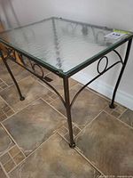 Full view of table showing frame and glass top