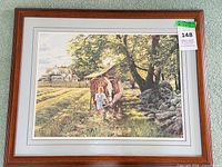 Full view of framed print showing image, matting, frame