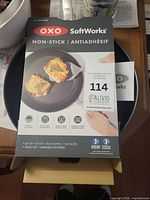 Boxed OXO SoftWorks non-stick skillet showing product details