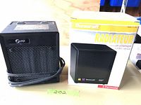 Front view of both heaters: black heater and Duracraft boxed heater