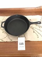 Top view of the Remy Olivier cast iron skillet showing overall shape, handles and spouts