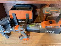 All four Ridgid items: blower, impact driver, radio, bag