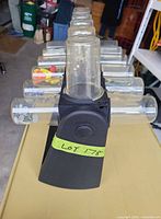 Front view of rotating organizer showing rows of attached empty jars