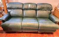 Front view of green leather three-seat sofa