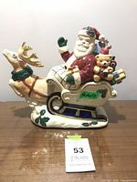 Full view of Fitz and Floyd Santa sleigh cookie jar front left
