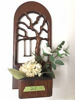 Front view showing full oak wall pocket with tree cut-out and pocket planter