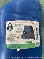 Label on blue stuff sack showing Woods logo, model 76-0733-G, weight and materials